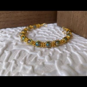 Gold toned wire wrapped beaded bracelet